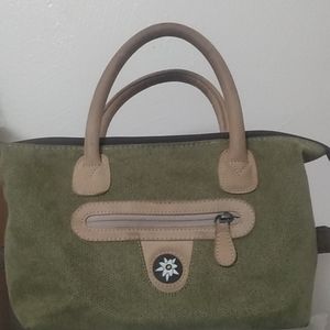A green flower purse with wallet inside
